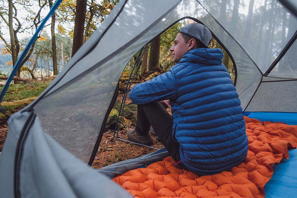 man sat in tent (6649448792137)