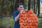 man blowing up sky-pad (6650791002185)